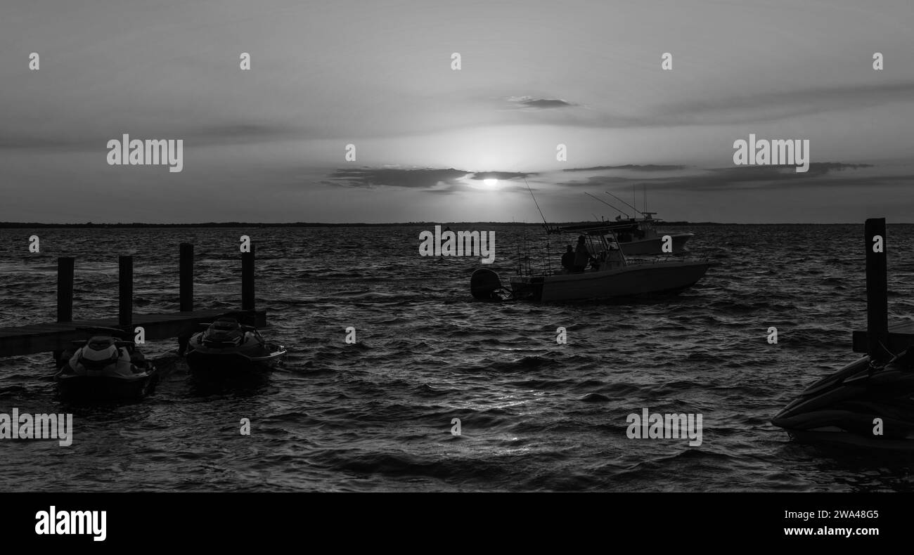 Caribbean yacht at sunset Black and White Stock Photos & Images - Alamy