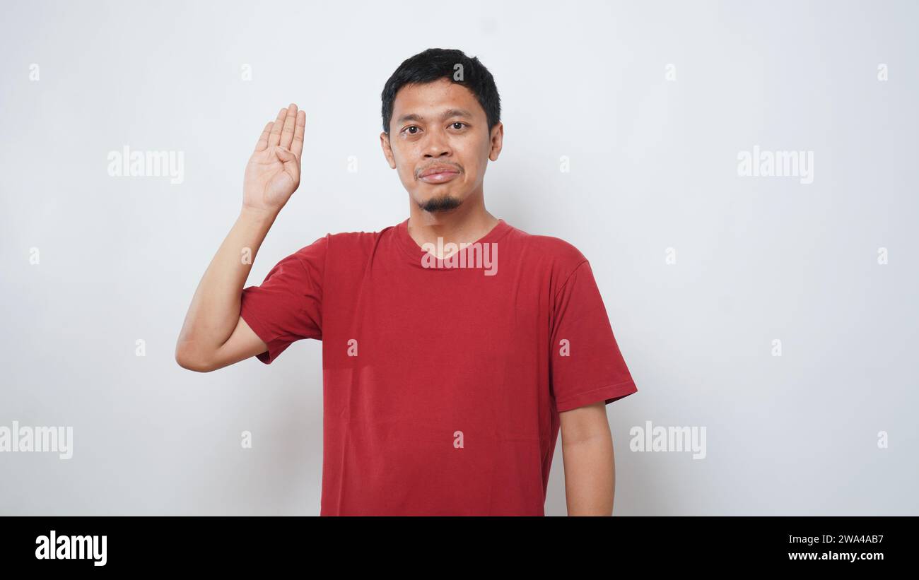 Asian man is using sign language with hand against white background. learn sign language by hand. ASL American Sign Language Stock Photo