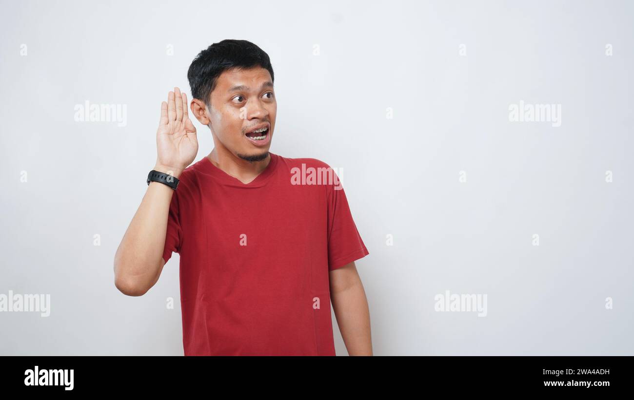 Asian man is using sign language with hand against white background. learn sign language by hand. ASL American Sign Language Stock Photo