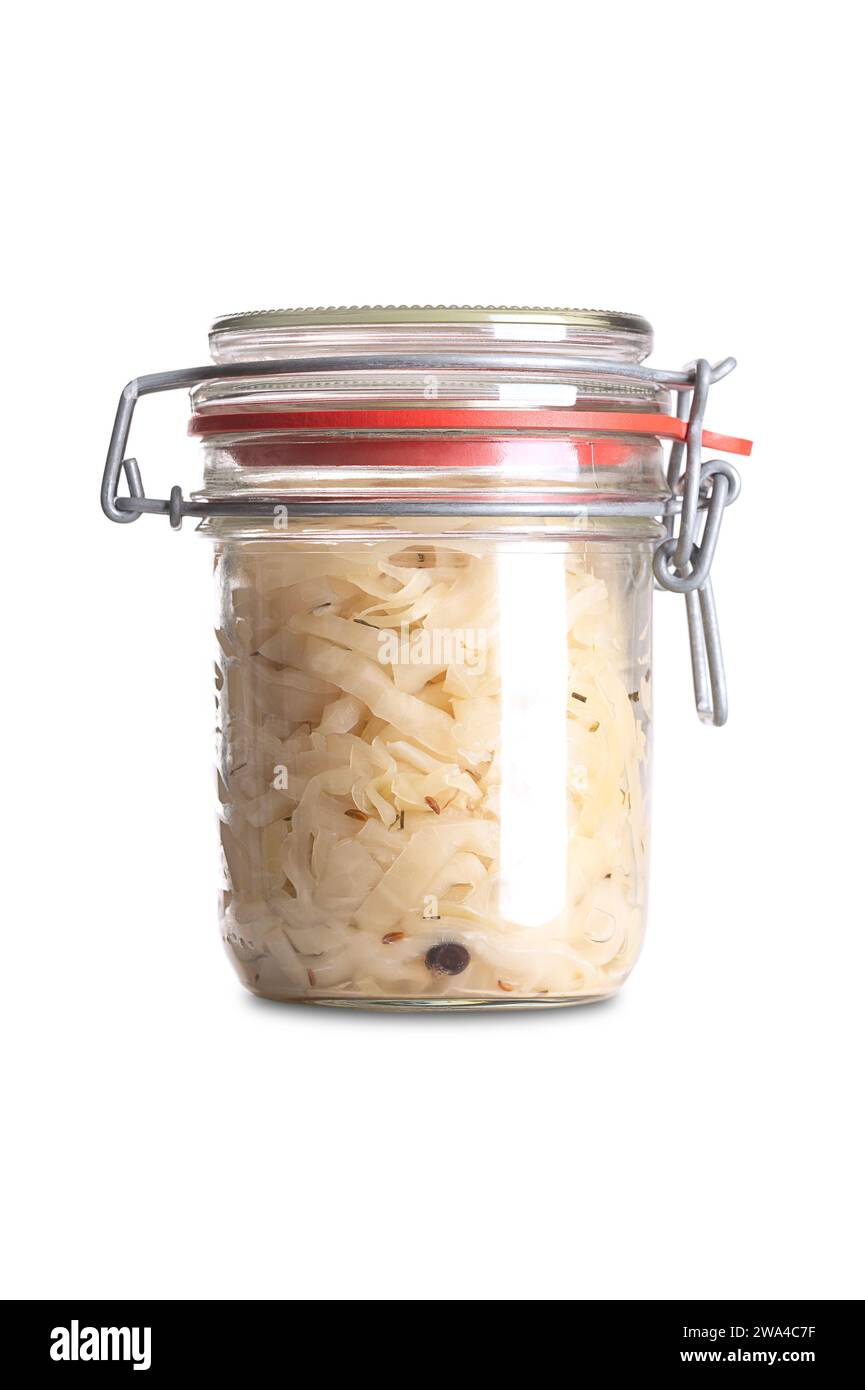 German sauerkraut, in swing top glass jar, front view. Cut raw cabbage, fermented by lactic acid bacteria. Traditionally a warm served side dish. Stock Photo