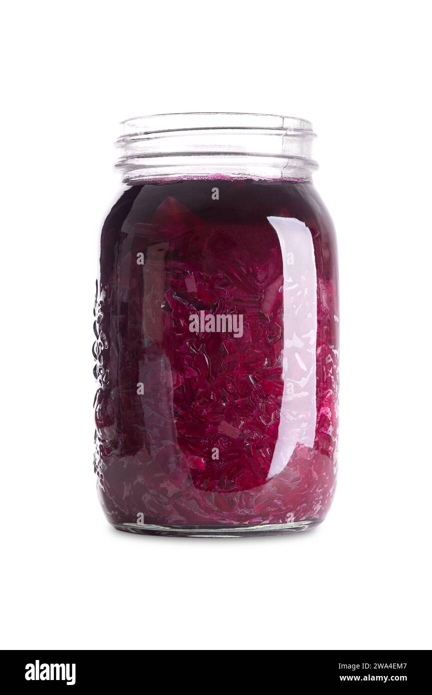 Red cabbage, homemade fermented German Blaukraut in a glass jar. Cut raw red cabbage, fermented by lactic acid bacteria. Stock Photo