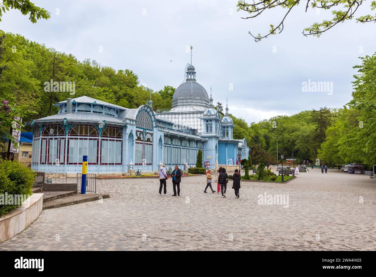 Zheleznovodsk, Russia - May 11, 2023: Tourists walk in front of Pushkin Gallery on a summer day Stock Photo