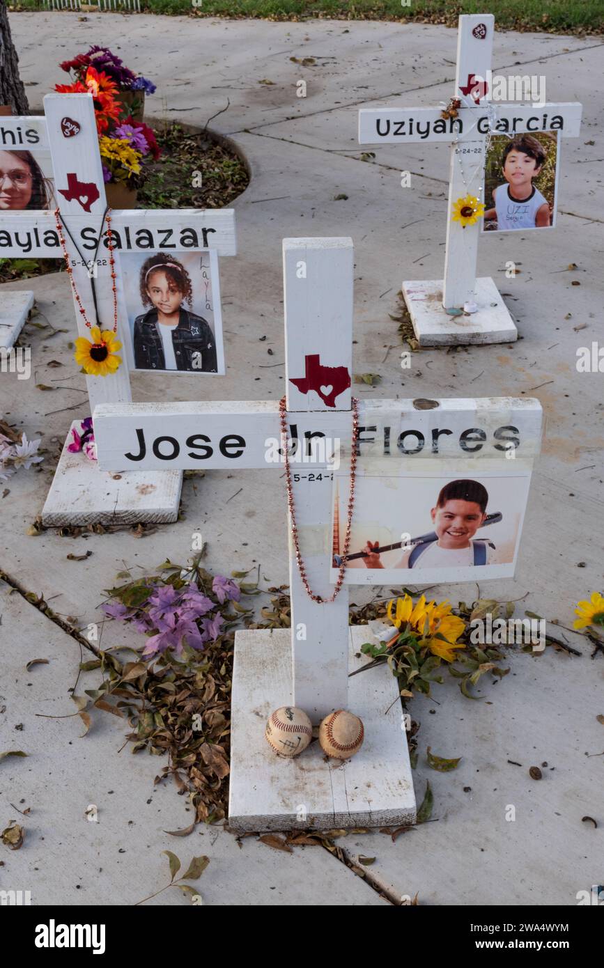 Memorial with crosses and photos for victims of school shooting in 2022 at Robb Elementary School, Uvalde, Texas, USA. Stock Photo