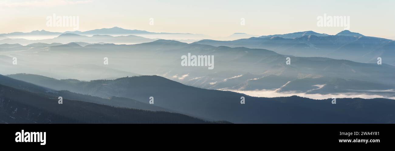 Mountain landscape with fog at sunrise with soft light. Beautiful ...