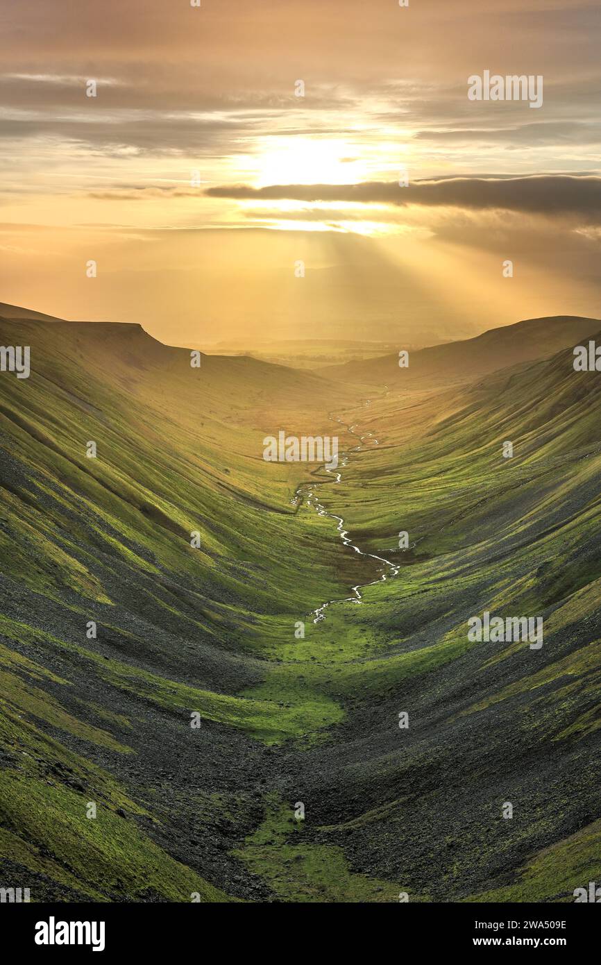 The glaciated valley of High Cup viewed from High Cup Nick at sunset, North Pennines, Cumbria, UK Stock Photo