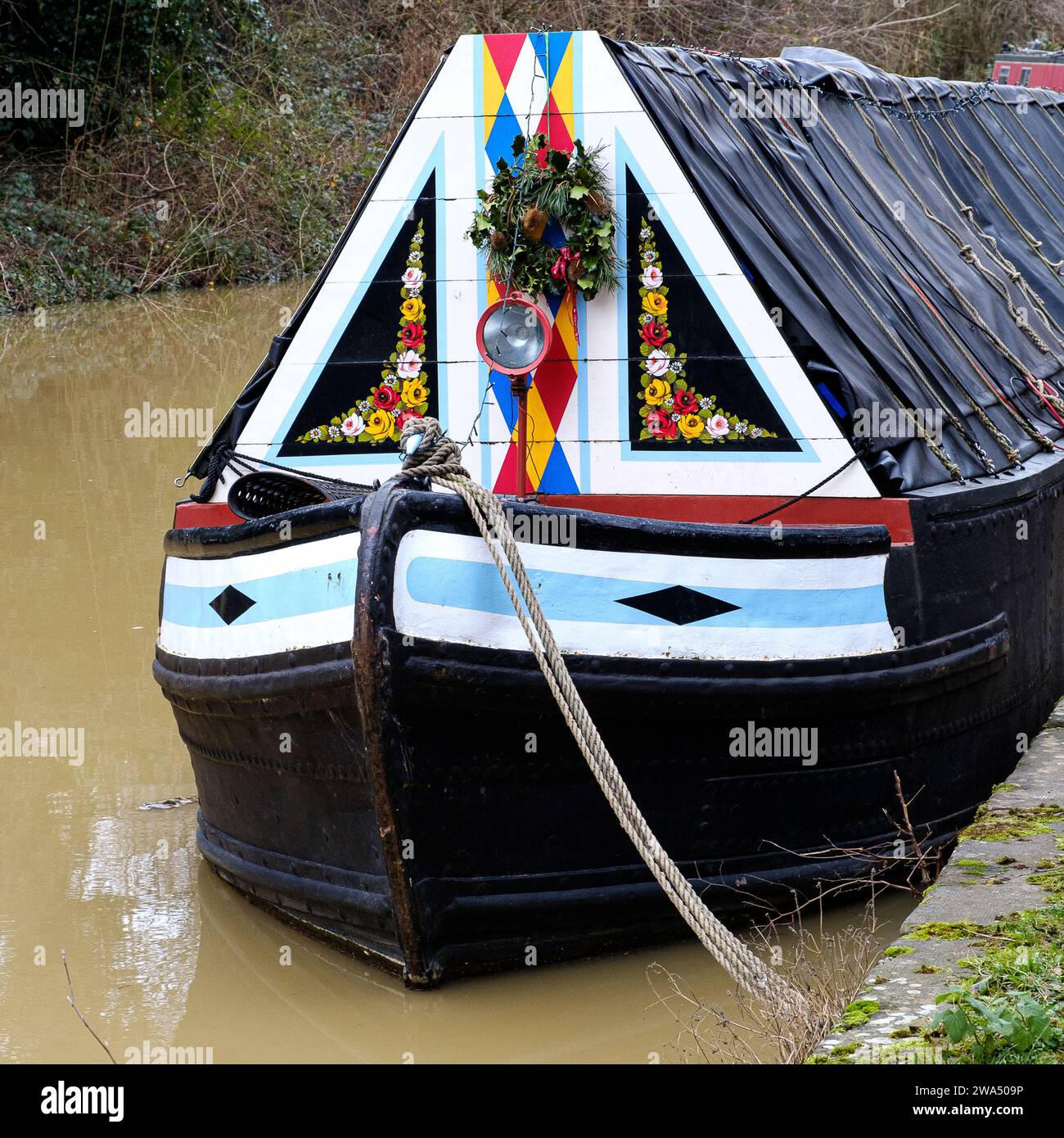 The decorated bow of a narrowboat on the Oxford Canal near Banbury, Oxfordshire Stock Photo
