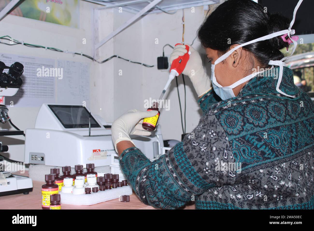 Lady Pathologist processing samples at the pathology laboratory for