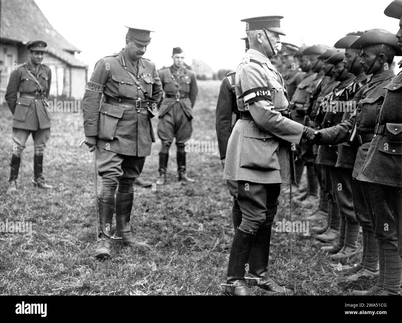 General Sir James Willcocks talking to Indian officers at an inspection parade near Merville, France, 1915. Photographer: H. D. Girdwood. Stock Photo