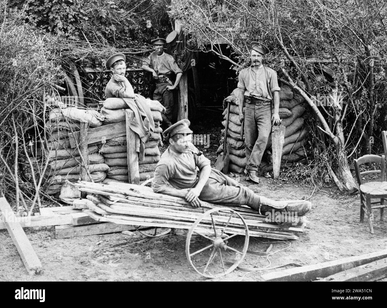 WW1 photo of German soldiers relaxing outside wood shelter WW1 photo of German soldiers relaxing outside wood shelter