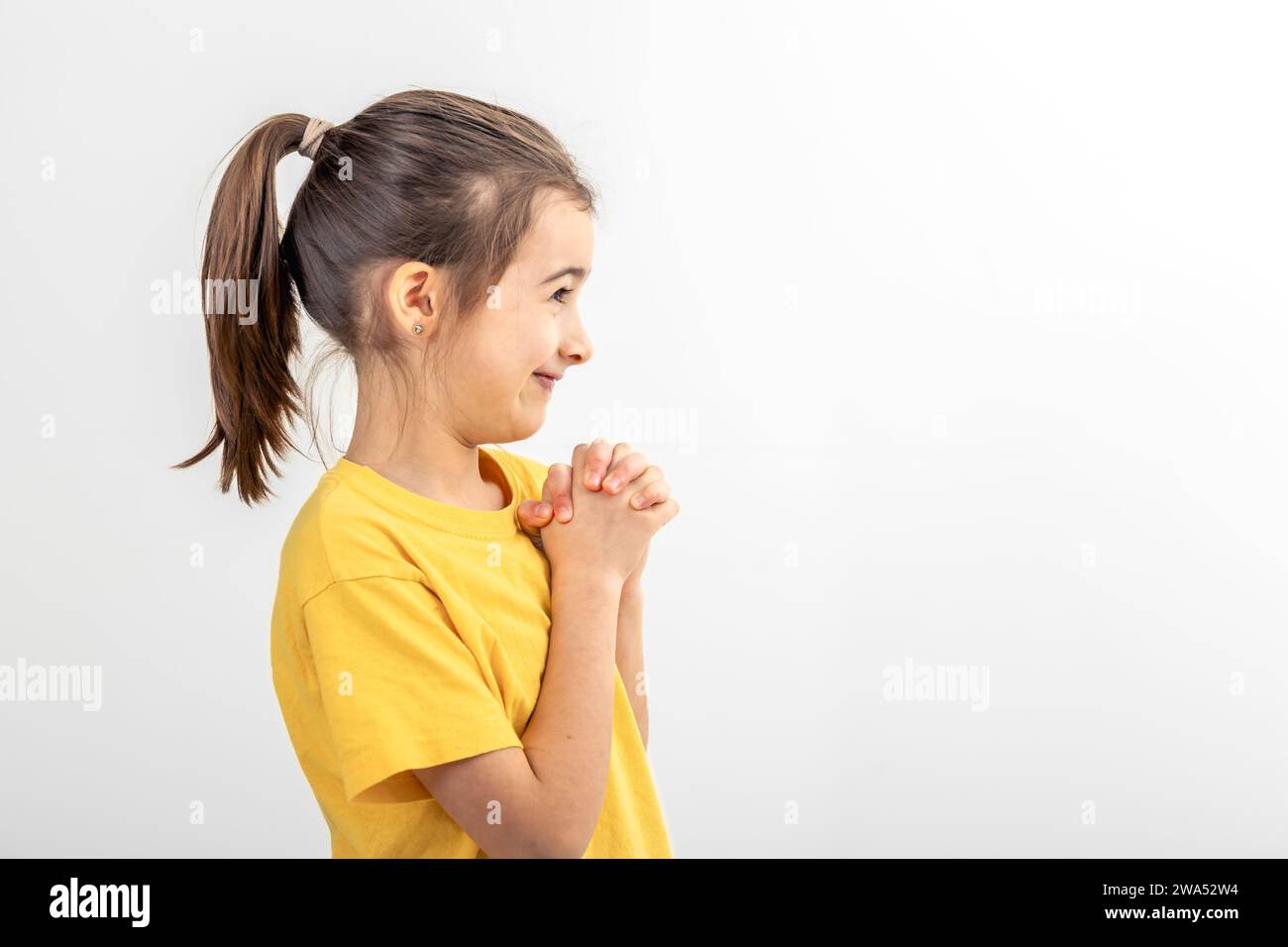 Cute little girl on a white background isolated Stock Photo - Alamy