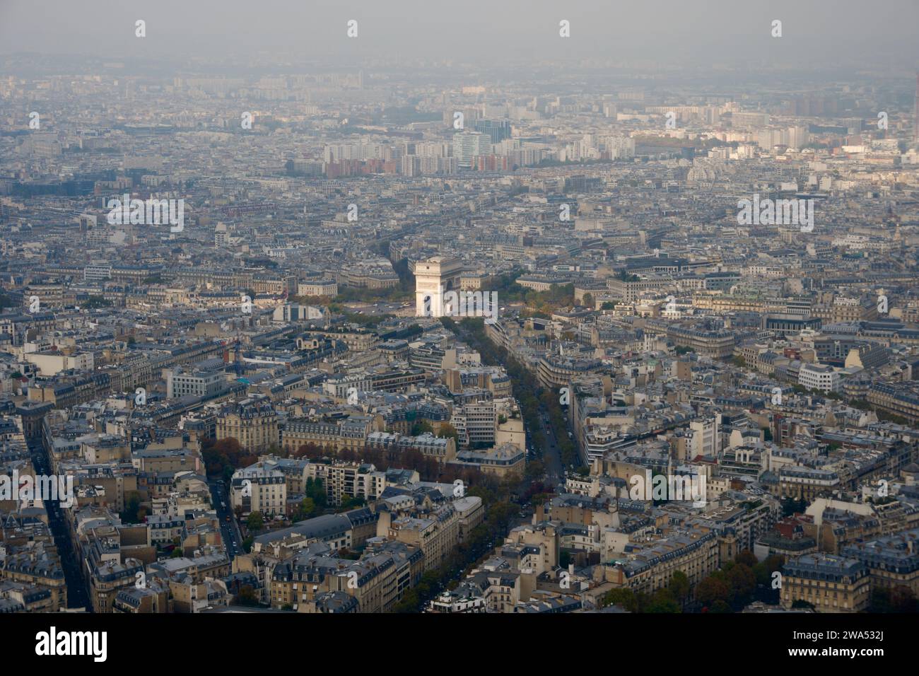 Immerse yourself in the heart of Paris with this breathtaking drone view of the Arc de Triomphe and radiating avenues. Stock Photo