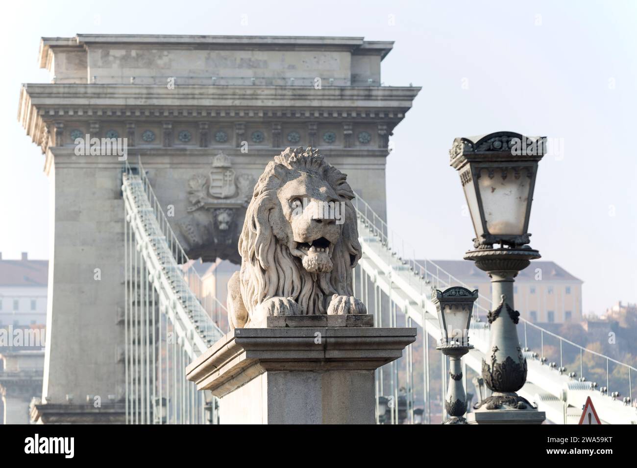 Hungary, Budapest, Lion Statue at Chain Bridge. Stock Photo