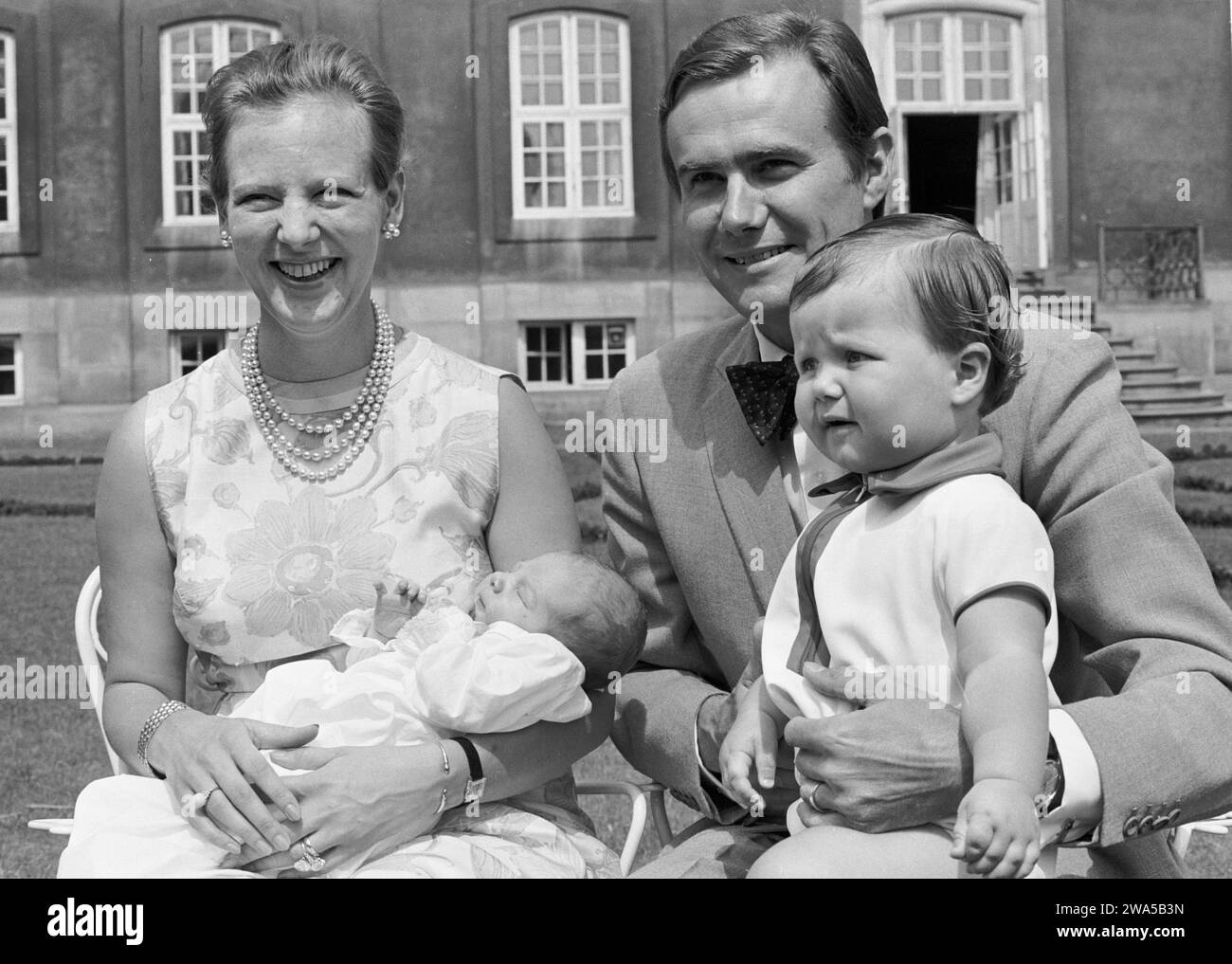 File - Princess Margrethe and Prince Henrik present their little newborn Prince Joachim while older brother Crown Prince Frederik looks on, at Fredenborg Castle, Denmark, 1969. Denmarks Queen Margrethe announced in her New Years speech that she is abdicating on January 14th 2024. Crown Prince Frederik will take her place and become King Frederik the 10th of Denmark. Stock Photo