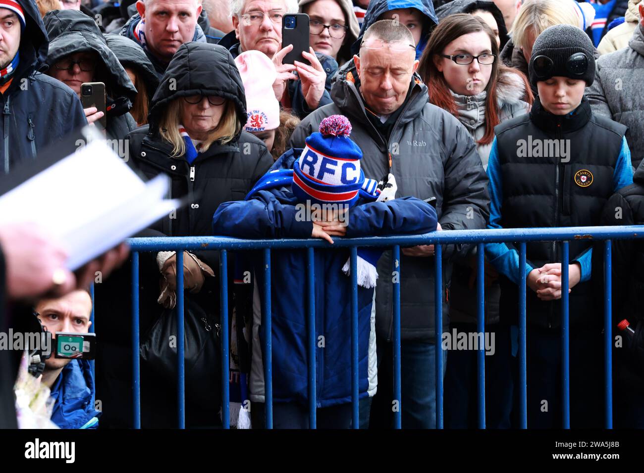 Rangers fans attend a service at the John Greig statue in memory of the ...