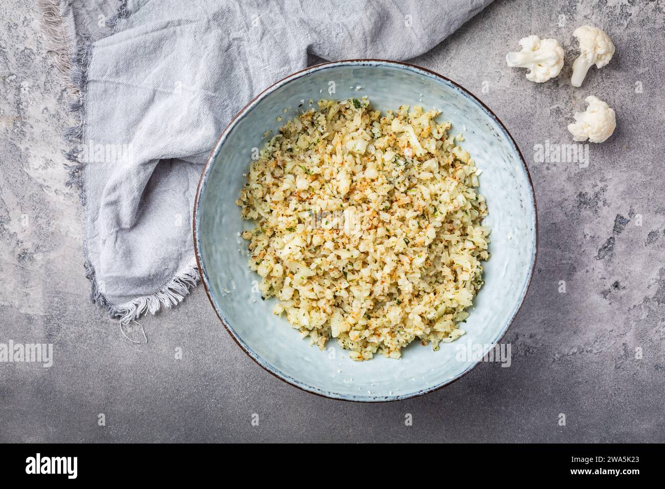 Roasted  organic cauliflower rice with herbs - paleo and ketogenic diet concept Stock Photo
