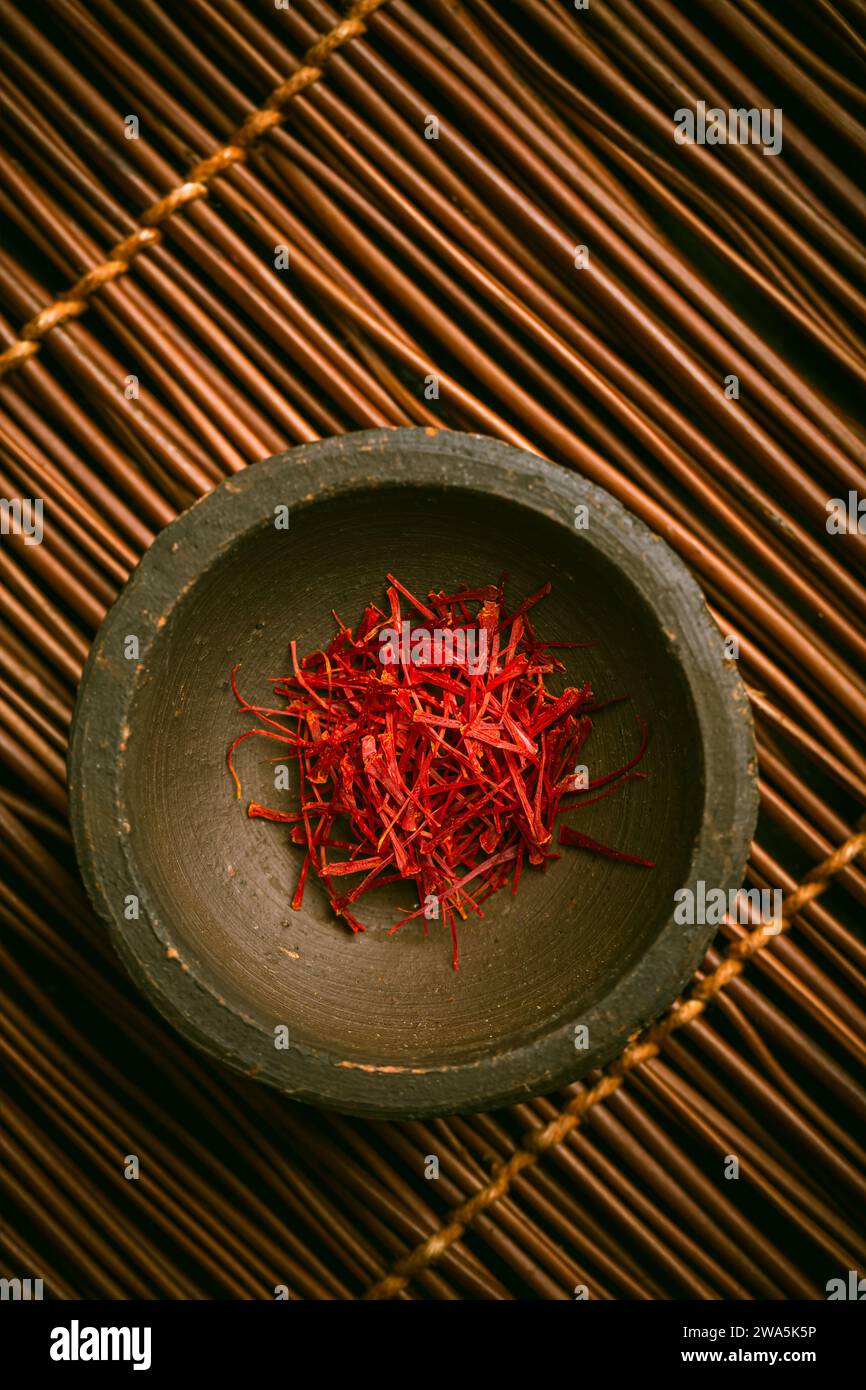 Saffron threads in a small bowl. Spices, cooking ingredients, flavor
