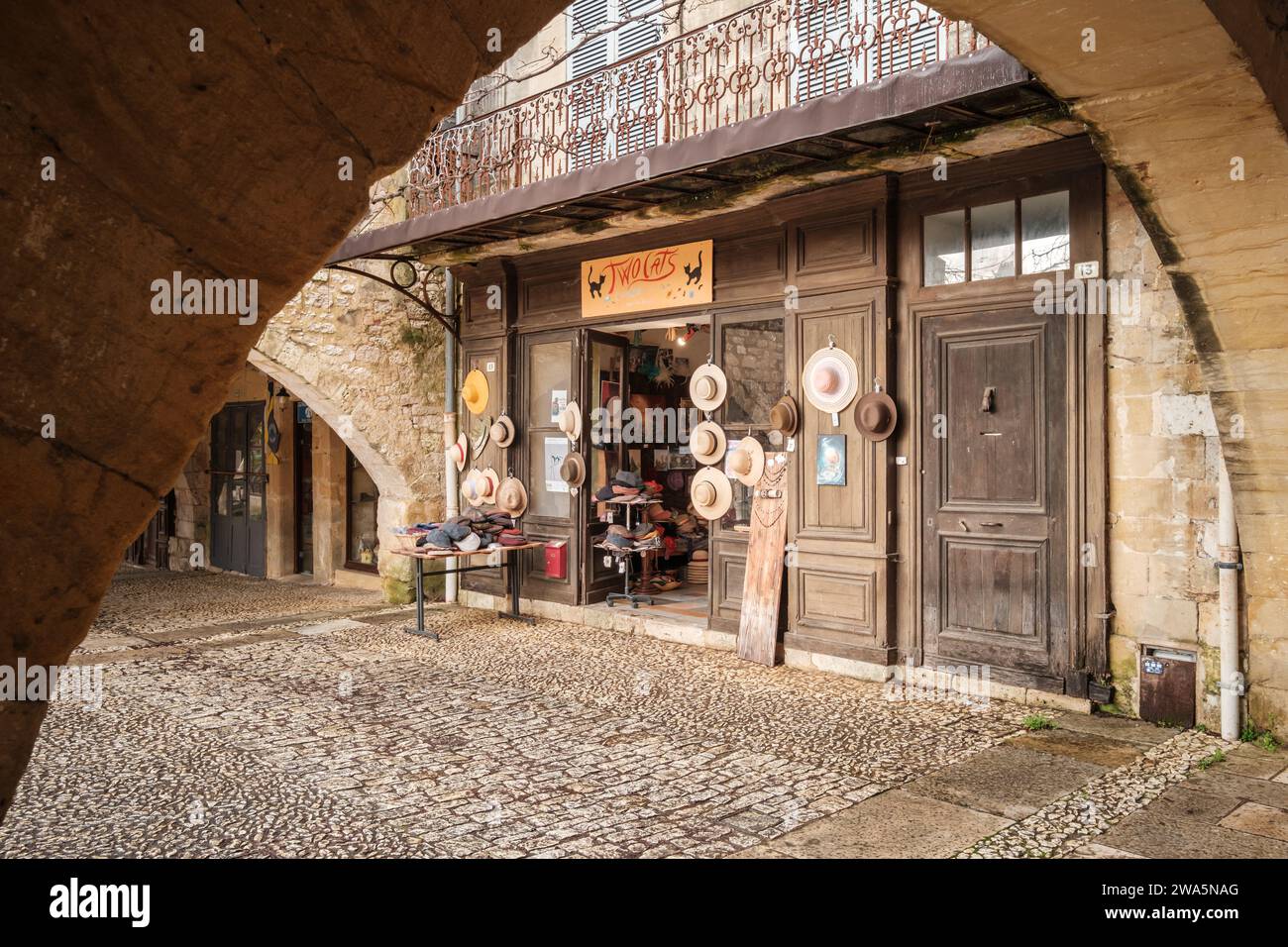 Monpazier, Nouvelle Aquitaine, France - 31st December 2023: A shop selling hats in the market square of the 13th century bastide of Monpazier in the D Stock Photo