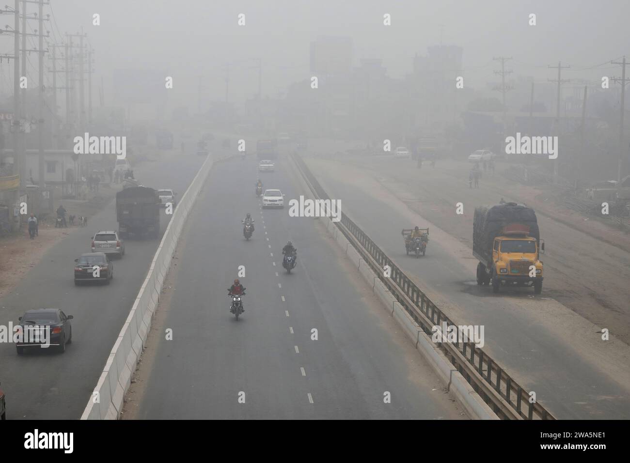 Dhaka, Bangladesh - January 01, 2023: Everywhere is covered in a blanket of fog in winter morning at Saver in Dhaka. Stock Photo