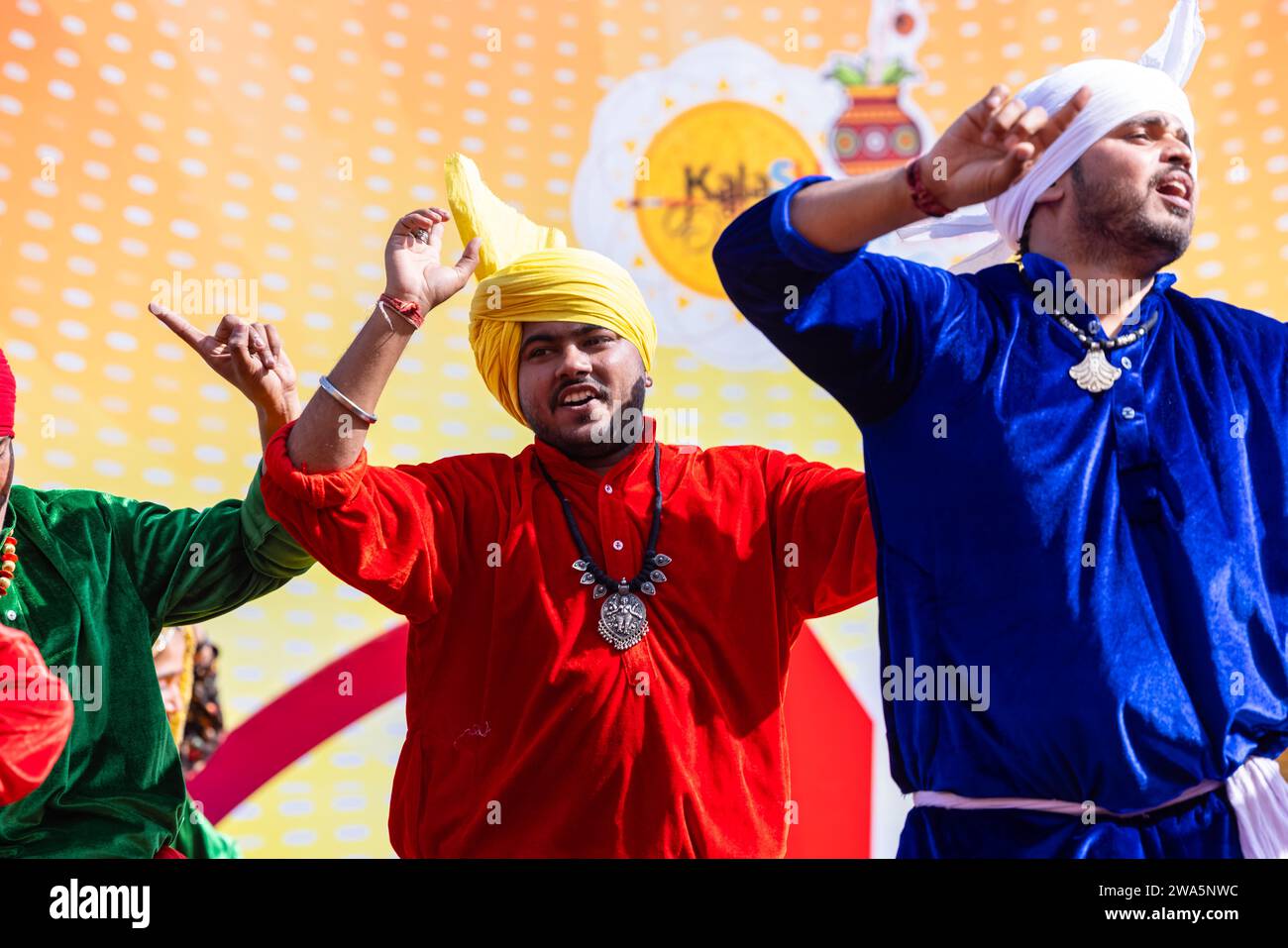 portrait of male artists from haryana while performing the folk dance of haryana in ethnic dress and turban at surajkund craft fair 2WA5NWC