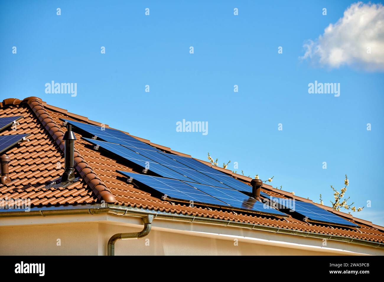 Solar thermal system on modern house roof Stock Photo - Alamy