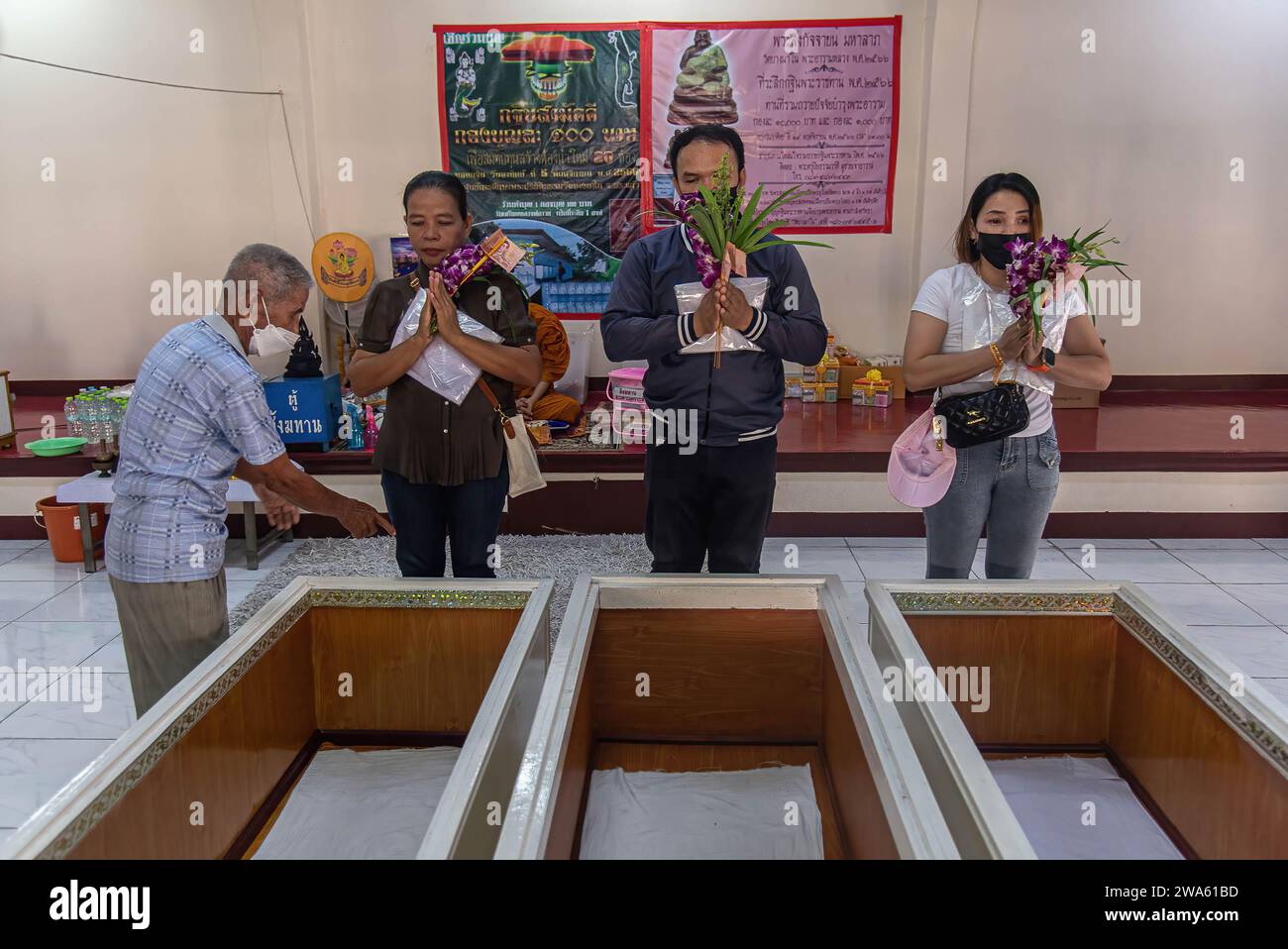 Reserection Ritual Bangkok, Thailand. 02nd Jan, 2024. Buddhist devotees pray before laying ...