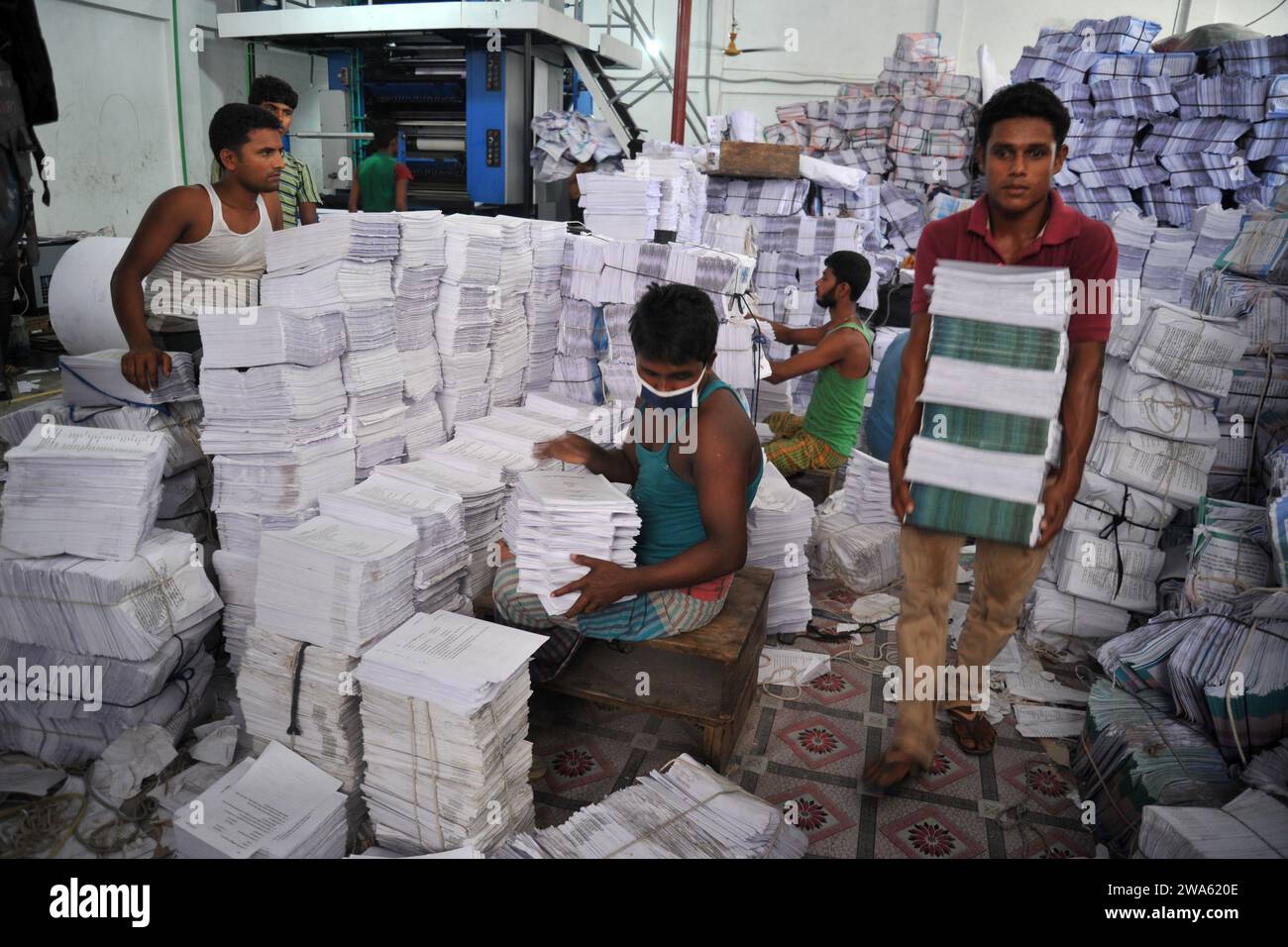 Bangladeshi worker works in a book binding factory in Dhaka City in ...
