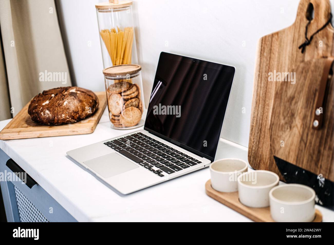 Kitchen Workstation Mockup with Empty Laptop Screen. An elegant kitchen ...