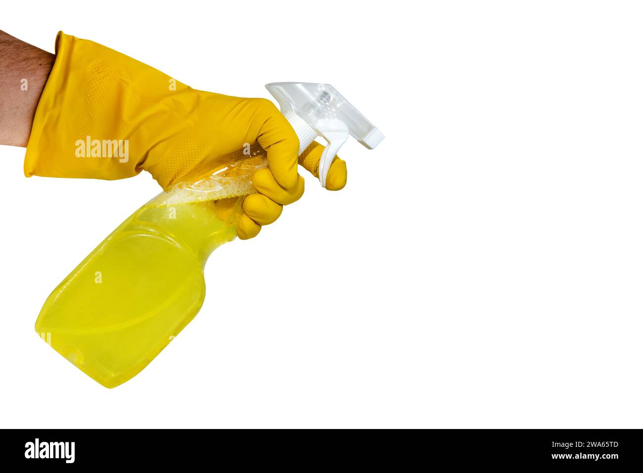A hand in yellow rubber gloves holds a spray bottle with a cleaning or ...