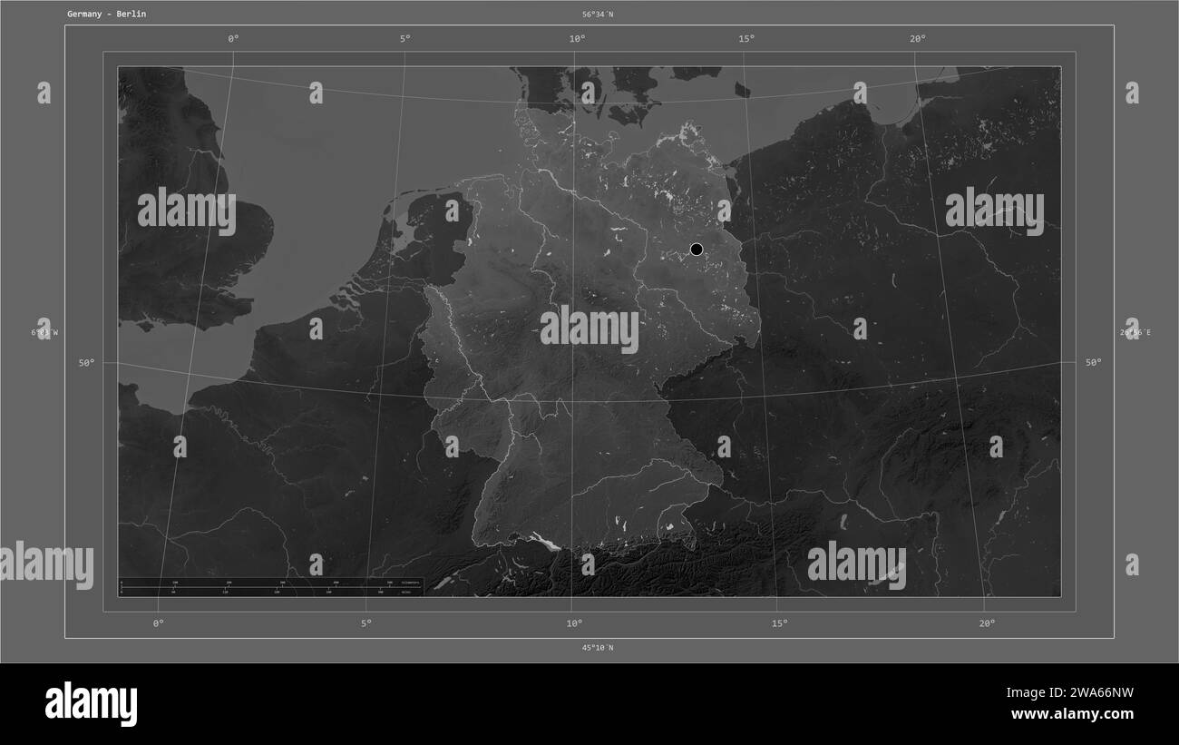 Germany highlighted on a Grayscale elevation map with lakes and rivers map with the country's capital point, cartographic grid, distance scale and map Stock Photo