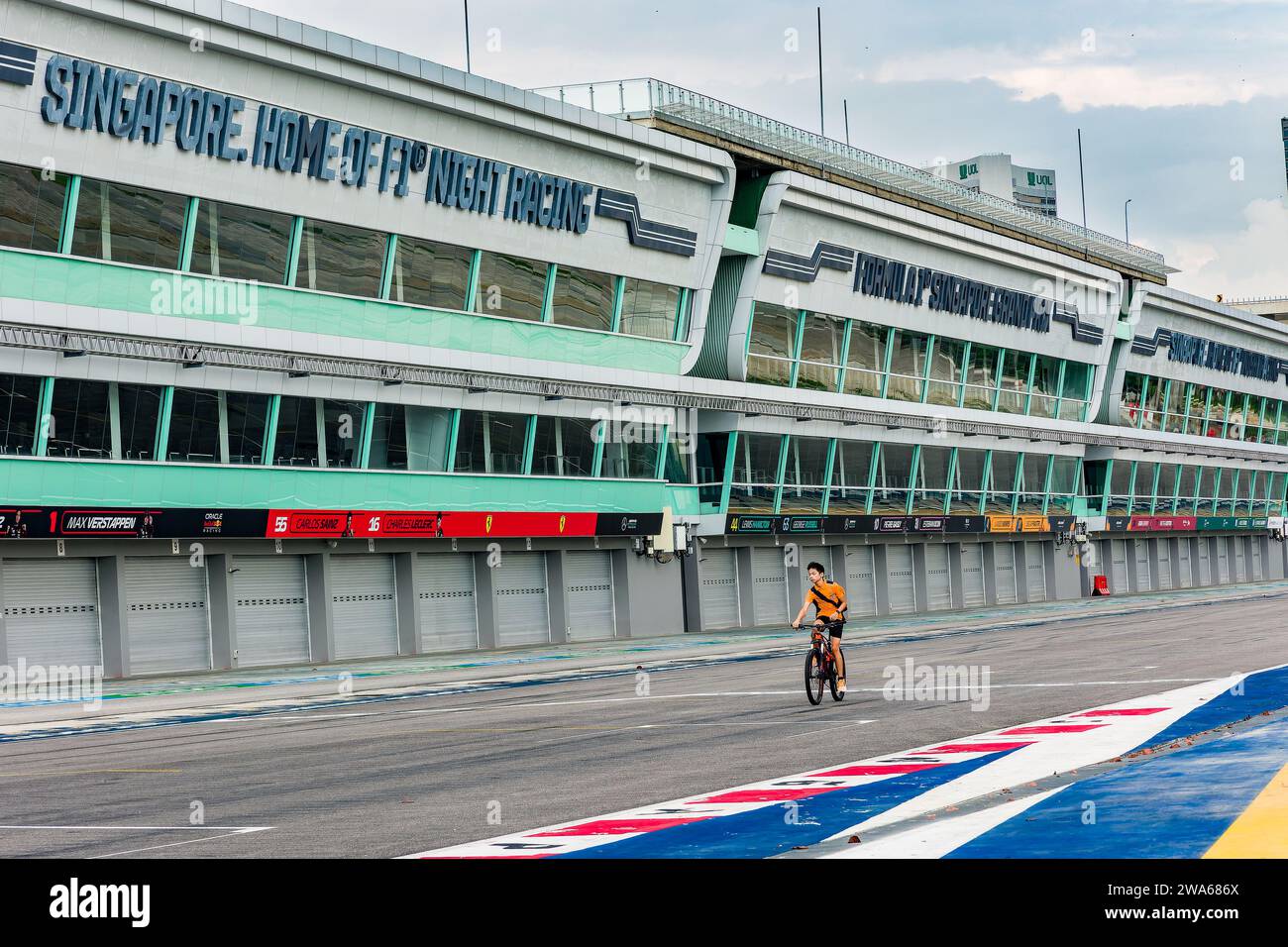 The start and finish straight and pit lane of the Marina Bay Street Circuit. When not used for motor races, the venue is Stock Photo