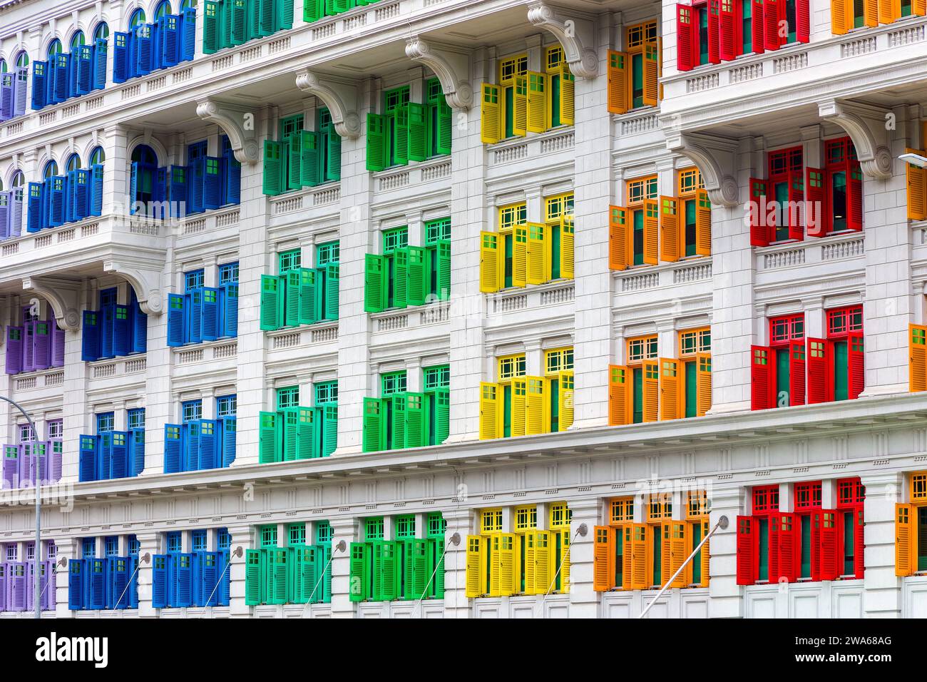 Brightly colored shutters and windows on the landmark Old Hill Street Police Station building in Singapore Stock Photo