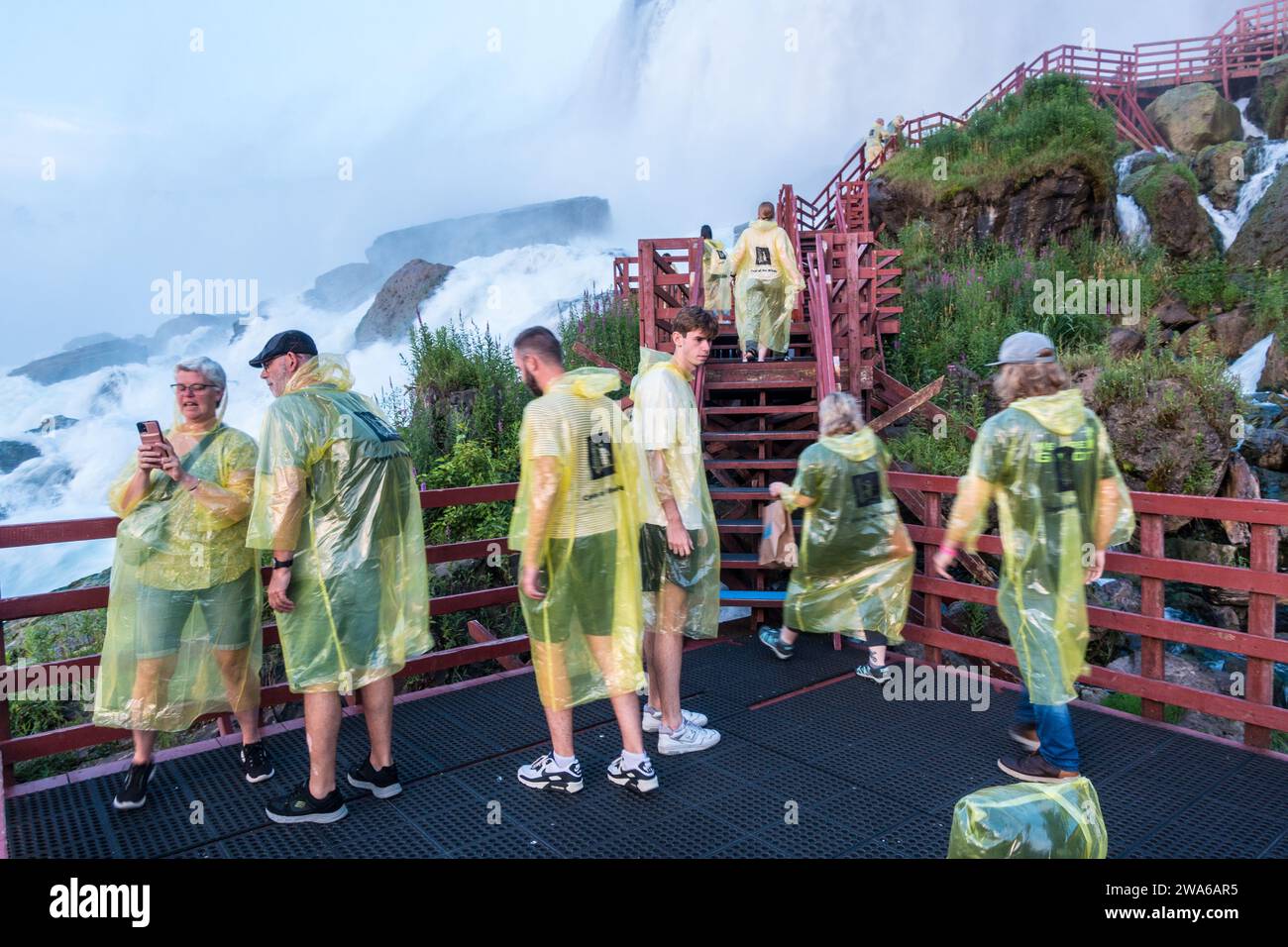 Tourists at Cave of the Winds attraction Niagara falls with poncho to