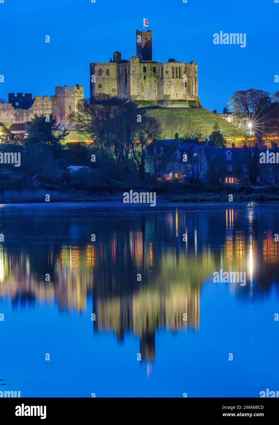 view-at-dusk-of-warkworth-castle-and-warkworth-village-reflected-in-the