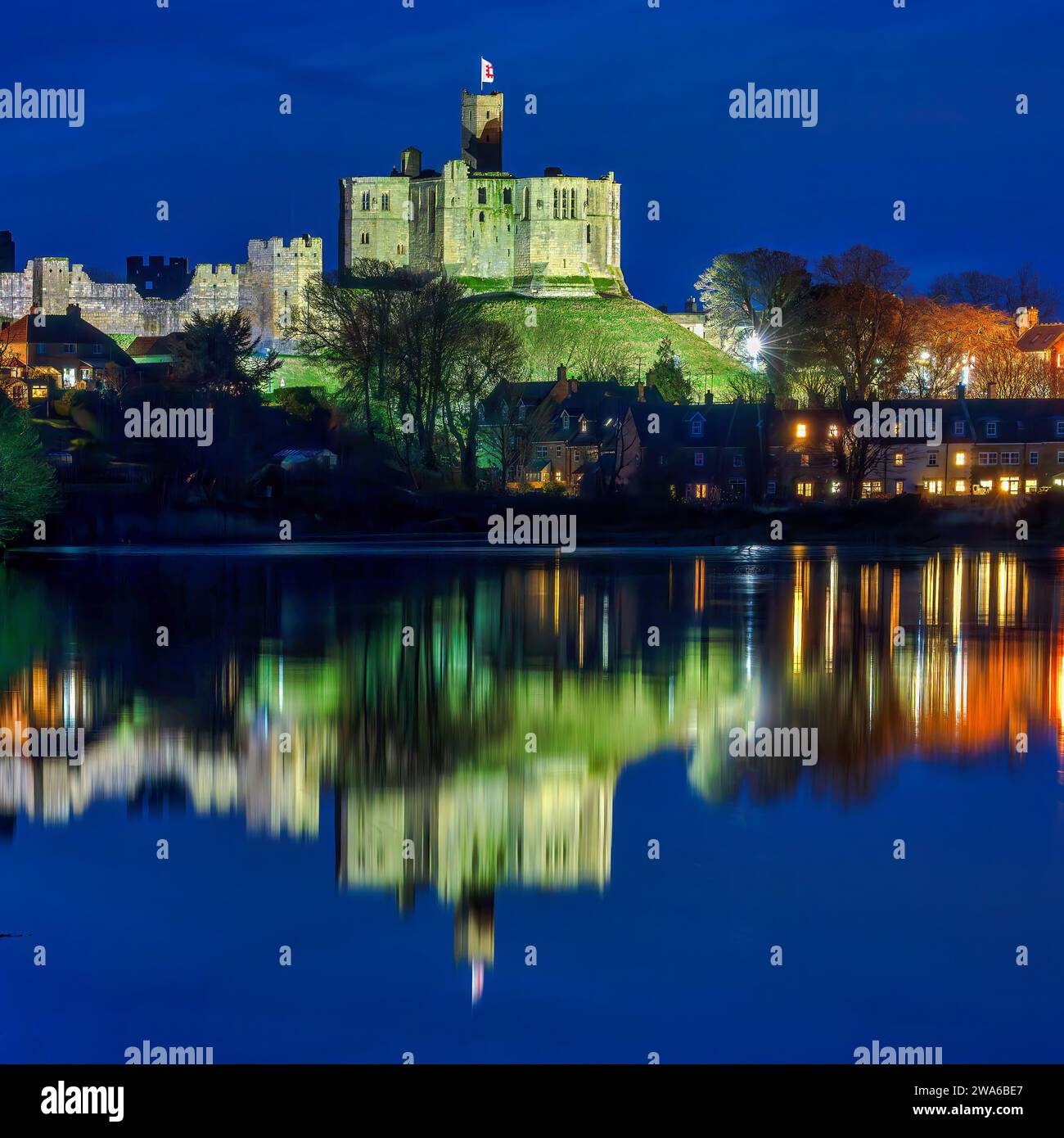 view-at-dusk-of-warkworth-castle-and-warkworth-village-reflected-in-the
