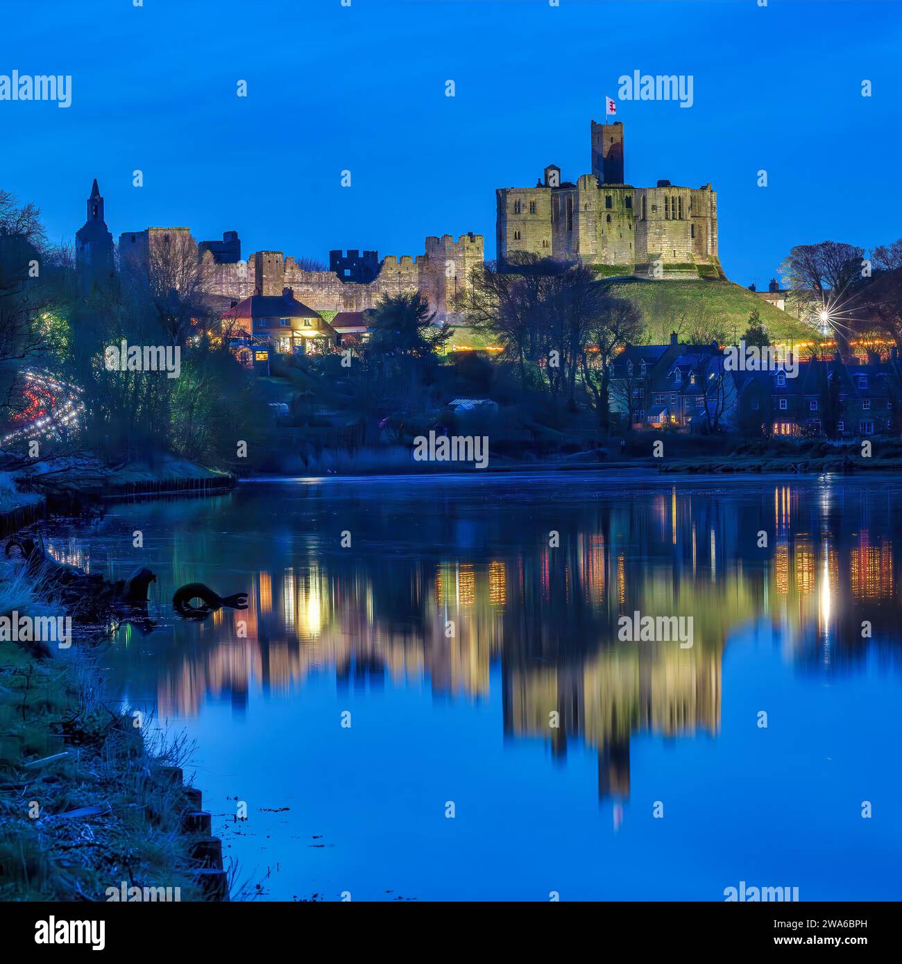 view-at-dusk-of-warkworth-castle-and-warkworth-village-reflected-in-the