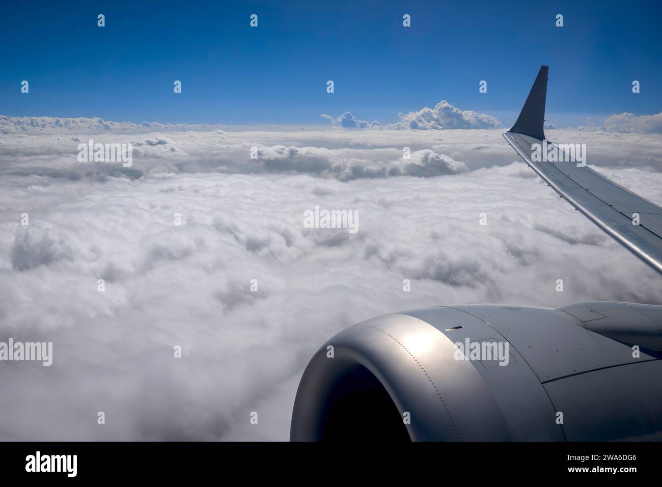 Clouds from above with plane engine and wing Stock Photo