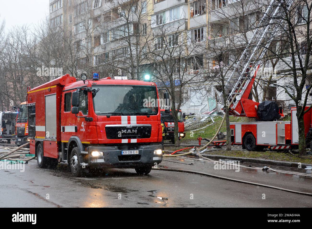 Firefighters attempt to extinguish a fire in a multi-storey building ...