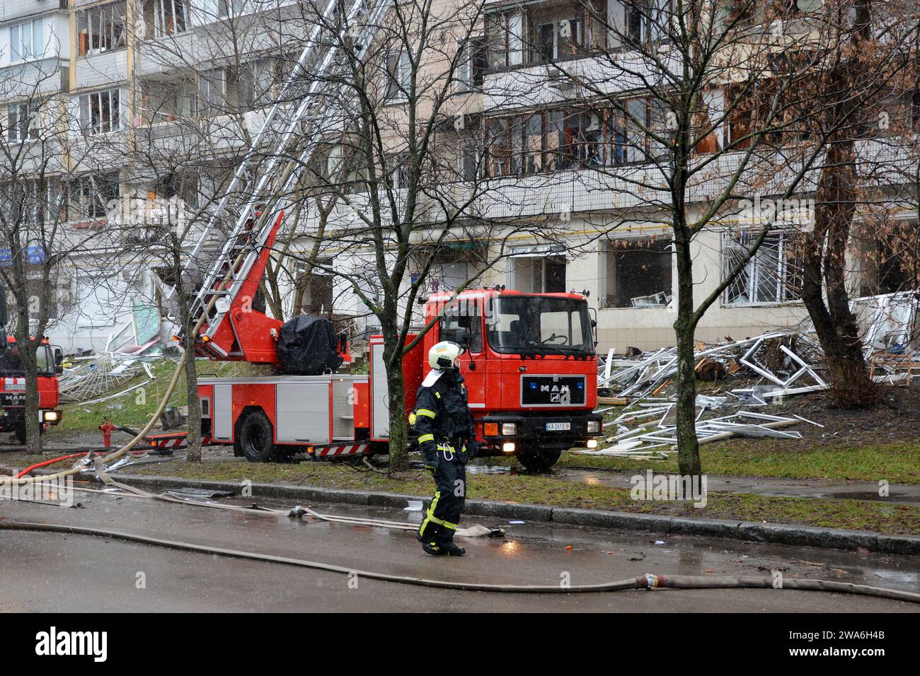 Firefighters attempt to extinguish a fire in a multi-storey building ...