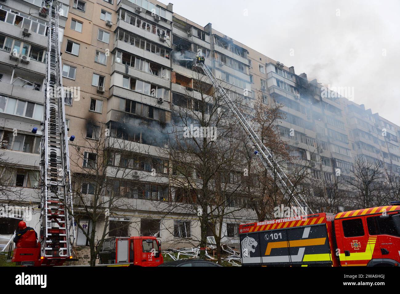 Kyiv, Ukraine. 02nd Jan, 2024. Firefighters attempt to extinguish a ...