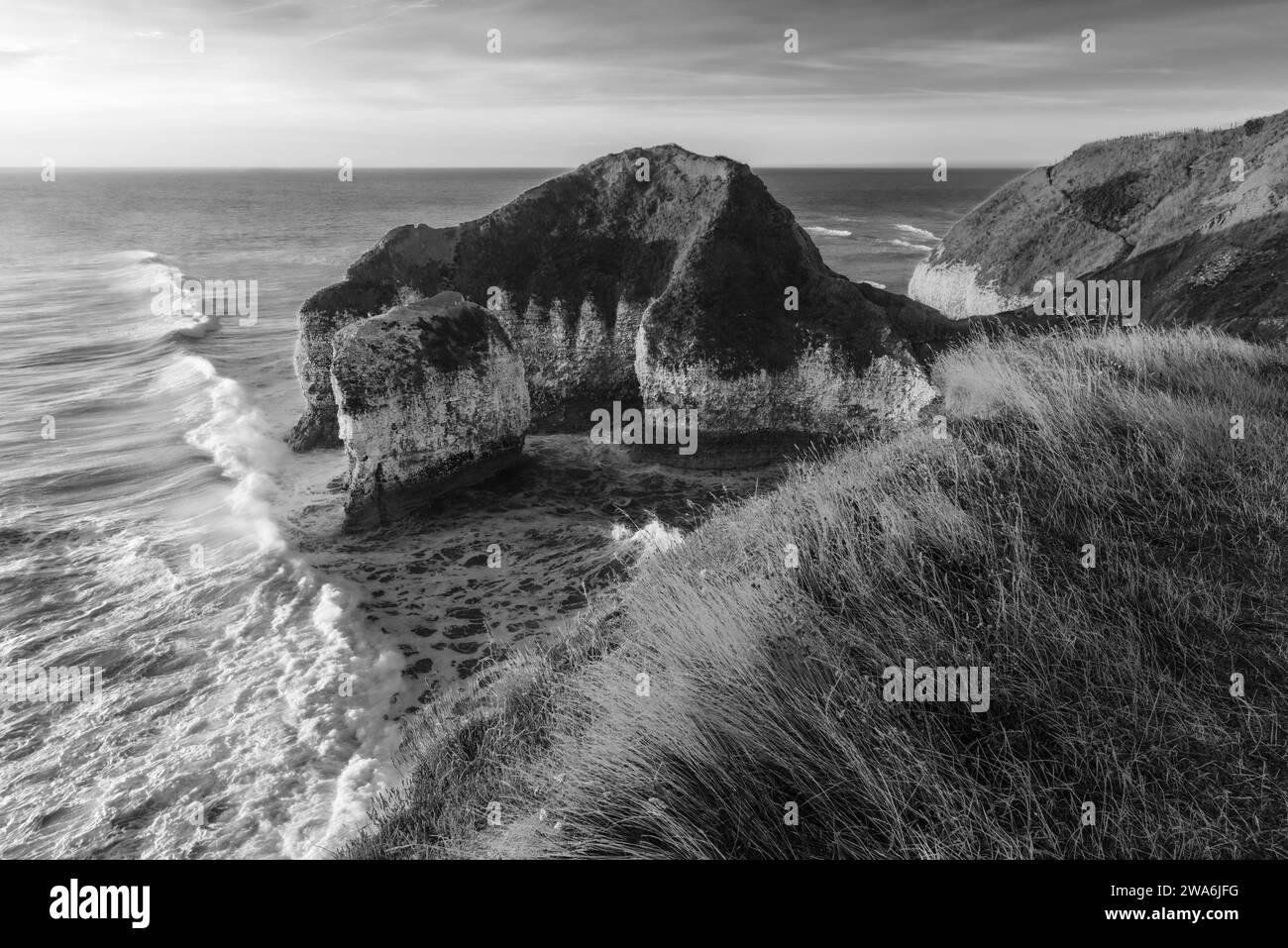Chalk cliffs and view of sea erosion flanked by the English Channel on a fine dawn morning at Flamborough Head, Flamborough, Yorkshire, UK. Stock Photo