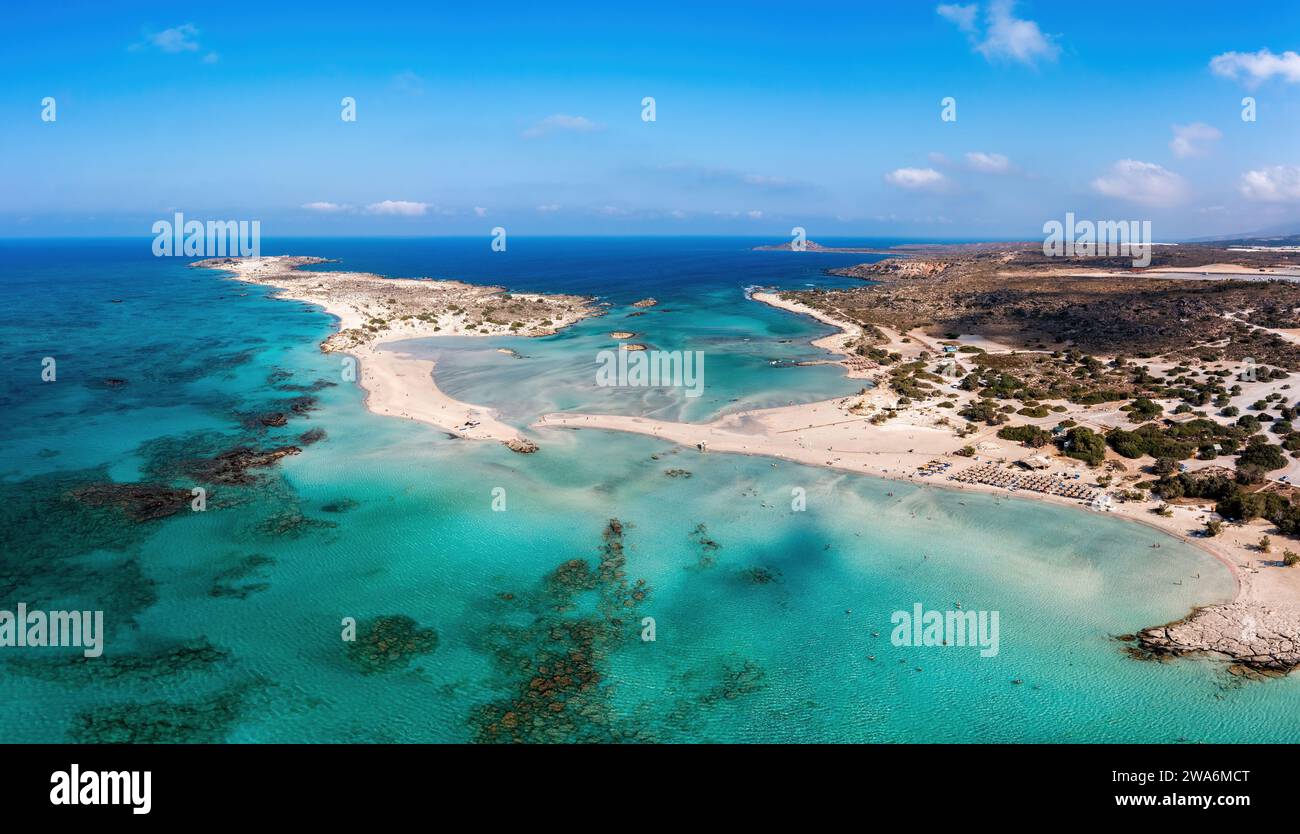 Elafonisi lagoon, Crete island Greece. Aerial drone view of turquoise transparent sea water, blue sky, beach with pink sand. Famous summer resort. Stock Photo