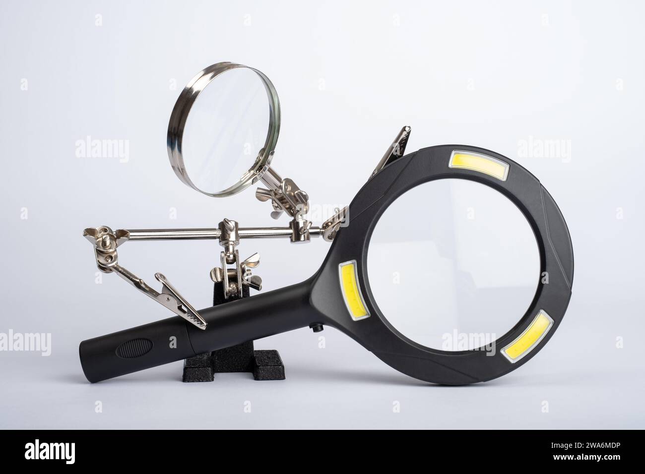 Magnifying Glass with Crocodile Clips Holding connector port peripheral computer usb cable Hands ...