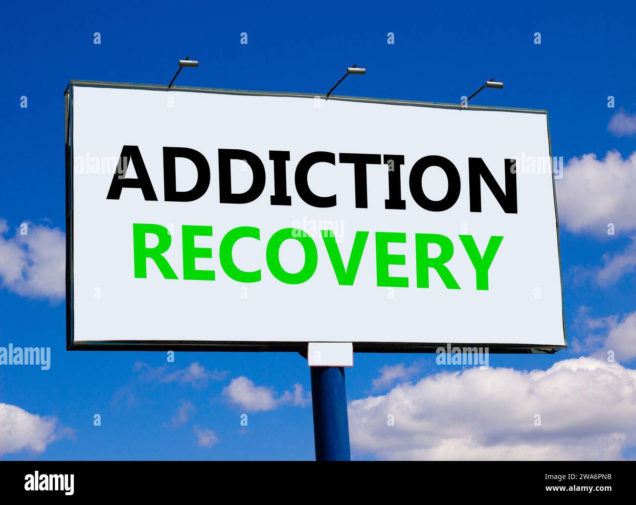 Addiction recovery symbol. Concept words Addiction recovery on beautiful white billboard. Beautiful blue sky white cloud background. Psychology addict Stock Photo