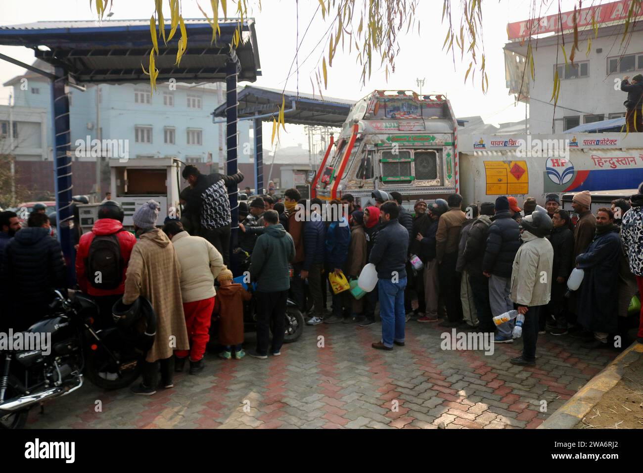 Srinagar kashmir india 02nd jan 2024 kashmiri people stand in a