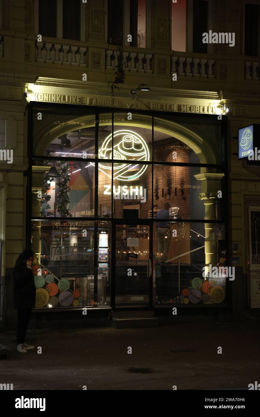 Nightview of sushi restaurant Zushi in Amsterdam, in former building of Royal Factory of Wicker Furniture (Koninklijke Fabriek van Rieten Meubelen) Stock Photo