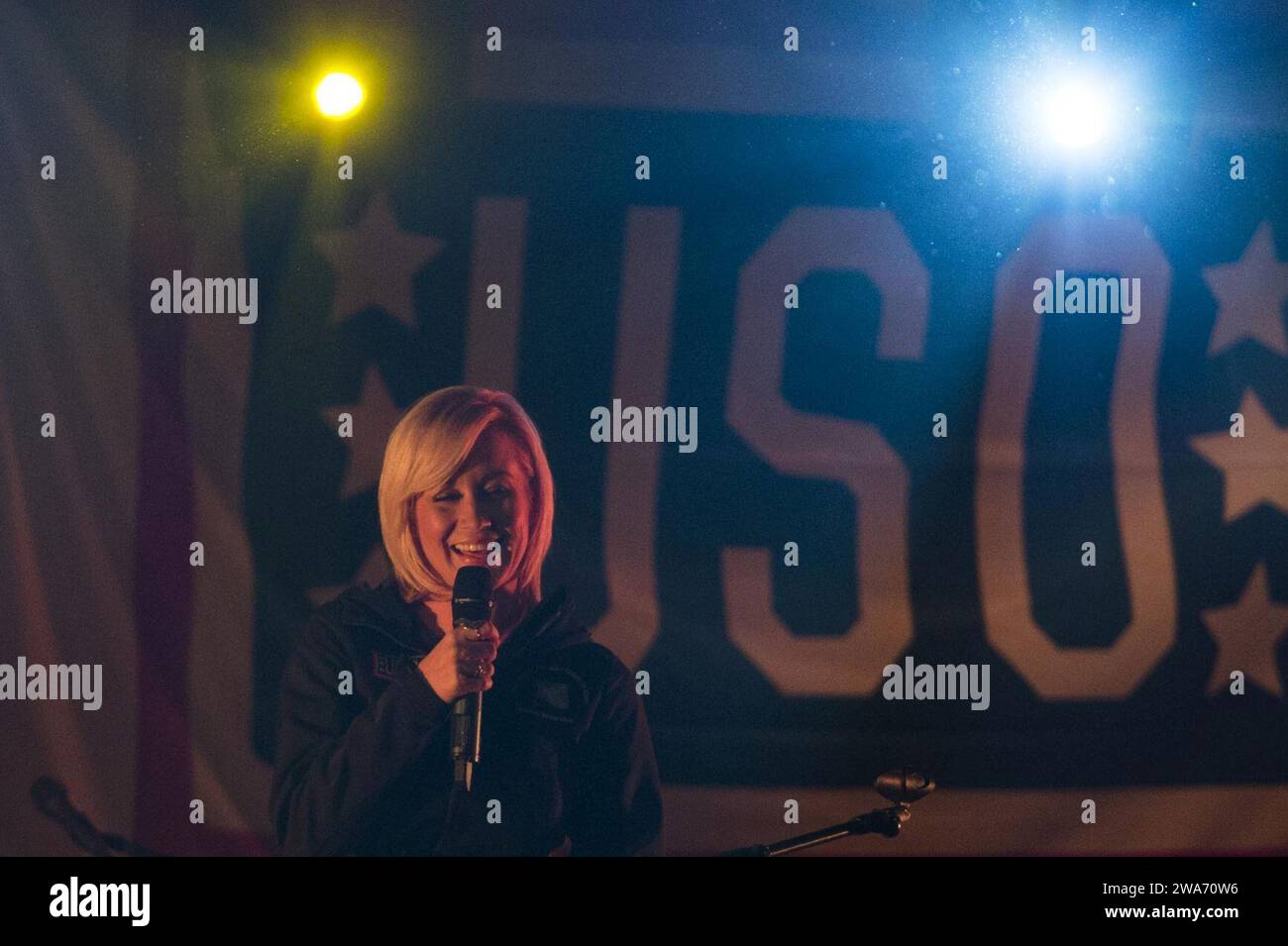 US military forces. Country music artist Kellie Pickler performs during a USO show for US service members and their families stationed at Rota Naval Air Station, Spain, Dec. 6, 2014.  (DOD photo by D. Myles Cullen/Released) Stock Photo