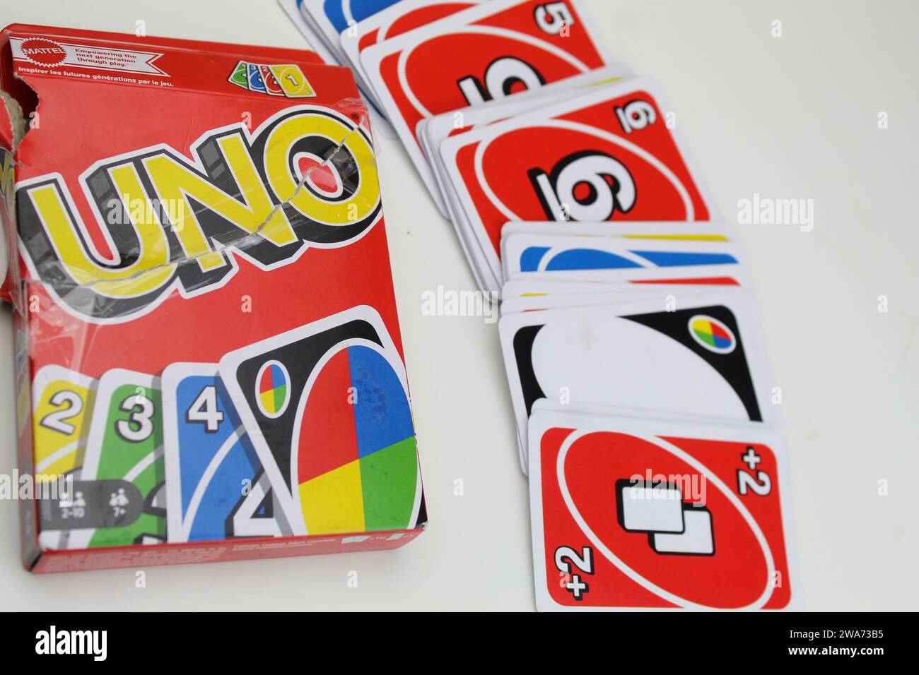 Dublin, Ireland - January 3rd 2024: A photo of a pack of UNO playing cards on a white desk. Stock Photo