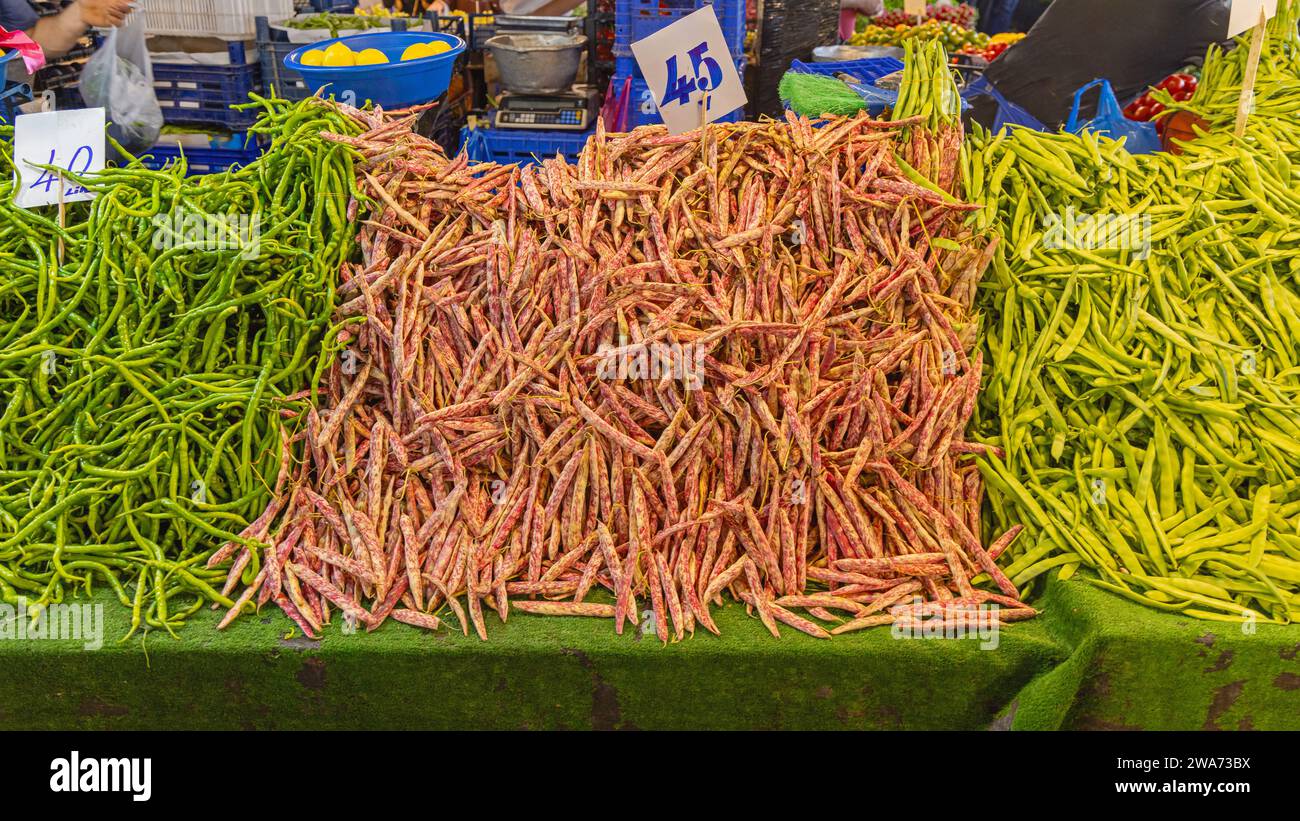 Big Bunch of Borlotti and Green String Beans at Farmers Market Stall Stock Photo