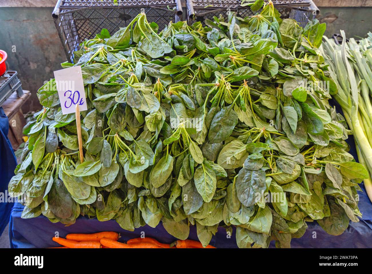 Large Pile of Spinach Leafy Greens Vegetable at Farmers Market Stock Photo