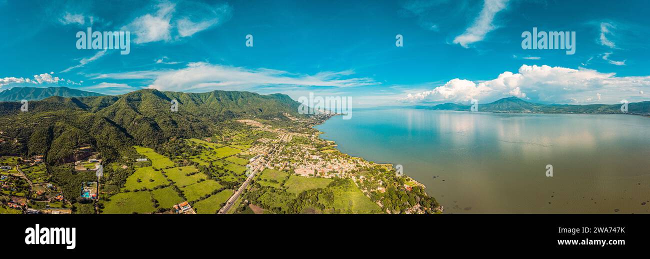 An aerial view of a lake with very blue sky and clouds on a sunny day Stock Photo